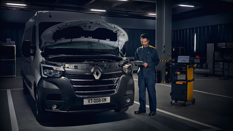 A customer shakes hand with Renault salesman