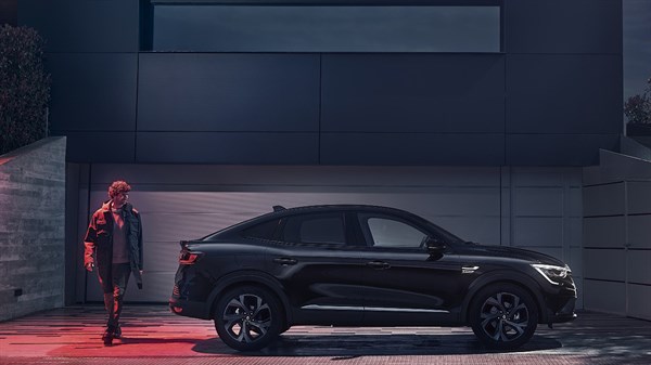 A Business man with Renault TALISMAN in urban environment